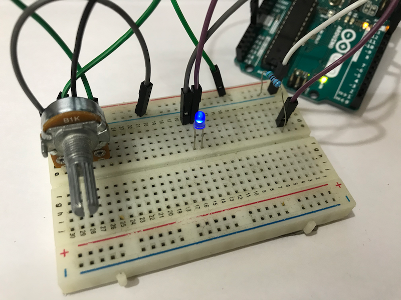 Control the brightness of an LED by a potentiometer